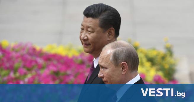 Прегръдката на руския президент Владимир Путин с китайския президент Си